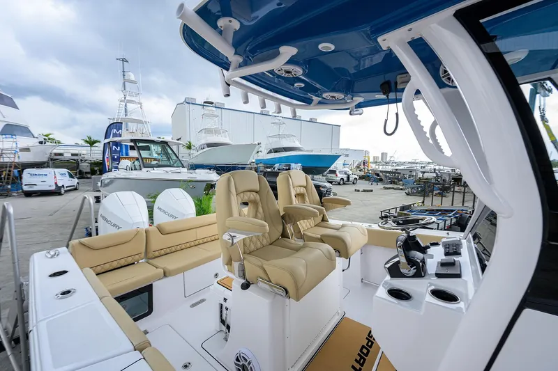 Slide: The Image of 2026 Sportsman Heritage 261 Center Console boat interior with luxurious seating and modern controls. - 13