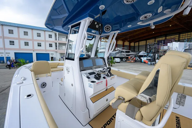 Slide: The Image of 2026 Sportsman Heritage 261 Center Console boat interior with modern helm and seating. - 14