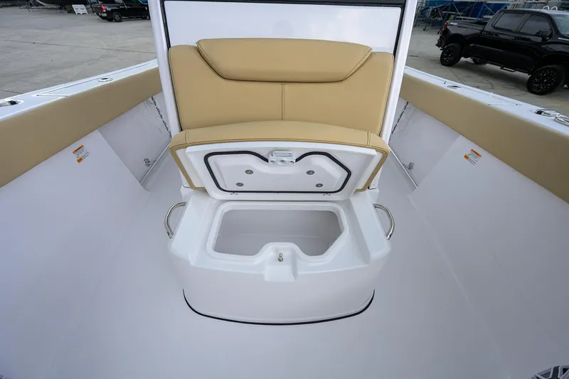 Slide: The Image of 2026 Sportsman Heritage 261 Center Console boat with open storage compartment. - 21