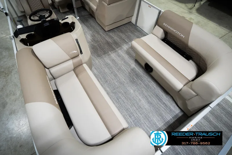 Slide: The Image of 2026 Bennignton 168 SL boat interior with beige seating and steering console. - 12