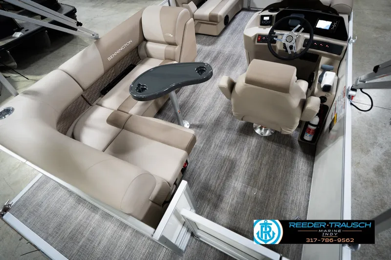 Slide: The Image of 2026 Bennignton 168 SL boat interior with beige seating and modern helm. - 13