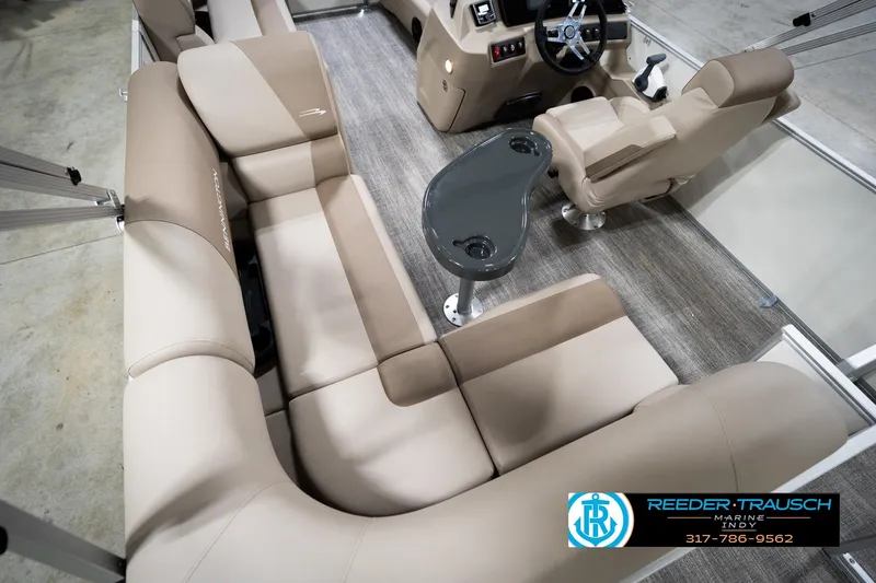 Slide: The Image of 2026 Bennignton 168 SL boat interior with beige seating and steering console. - 14