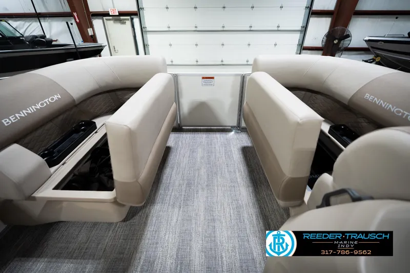 Slide: The Image of 2026 Bennignton 168 SL boat interior with beige seating and storage compartments. - 19