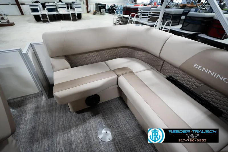 Slide: The Image of Luxurious seating on 2026 Bennignton 168 SL pontoon boat in showroom setting. - 21