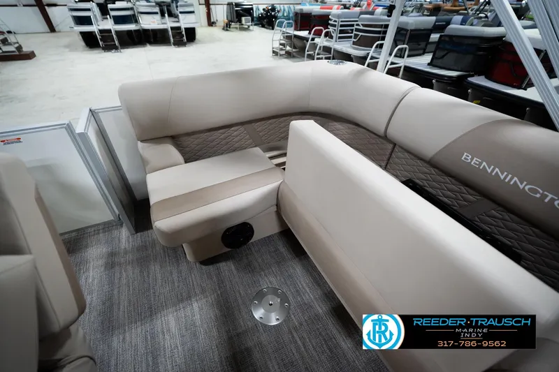 Slide: The Image of 2026 Bennignton 168 SL boat interior with beige seating and quilted accents. - 22