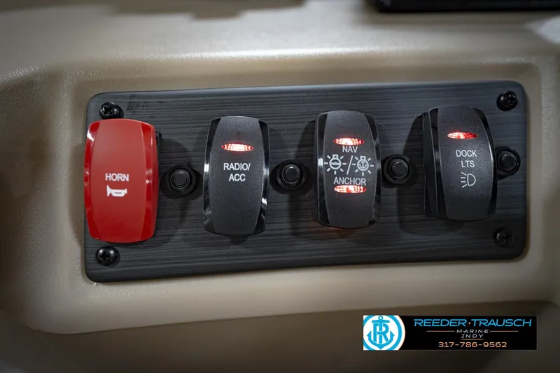 Slide: The Image of Control panel of 2026 Bennignton 168 SL boat with horn, radio, navigation switches. - 31