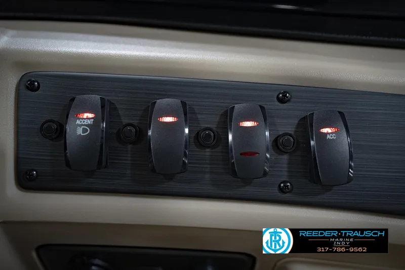 Slide: The Image of Control panel of 2026 Bennignton 168 SL boat with illuminated switches. - 35