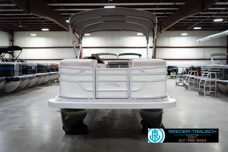 Slide: The Image of 2026 Bennignton 168 SL pontoon boat in showroom, front view with canopy. - 4