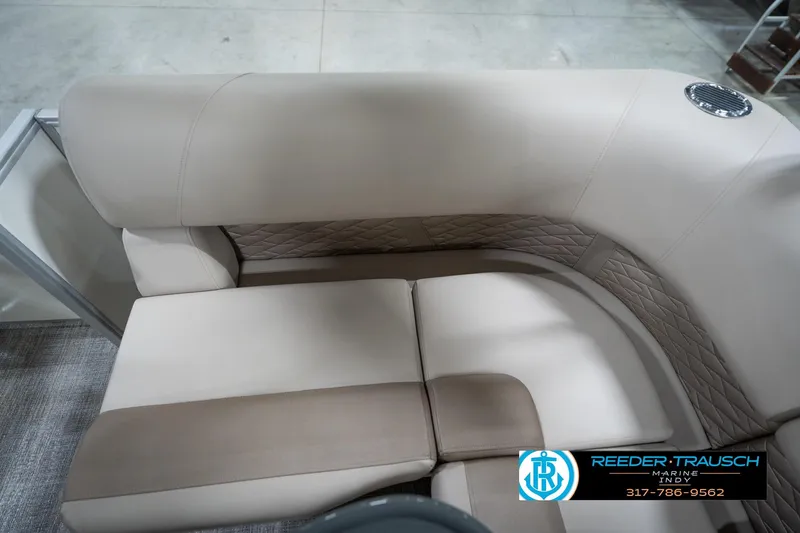 Slide: The Image of 2026 Bennignton 168 SL boat interior with beige and brown cushioned seating. - 43