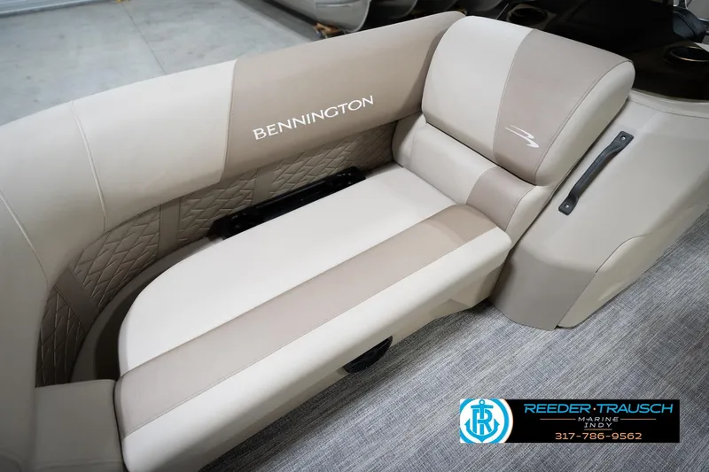 Slide: The Image of 2026 Bennignton 168 SL boat interior with beige seating and quilted accents. - 51