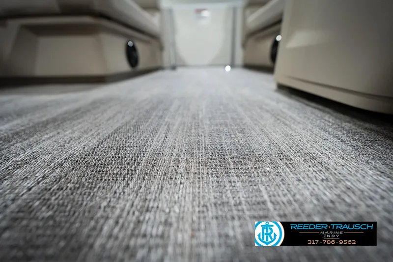 Slide: The Image of Gray textured flooring inside a 2026 Bennignton 168 SL boat, showcasing interior design. - 52