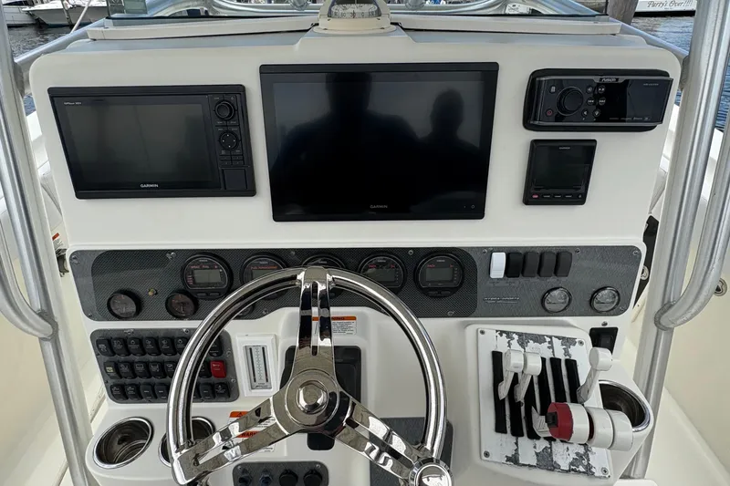Slide: The Image of 2007 Hydra-Sports Vector 3300 CC dashboard with navigation and control systems. - 14