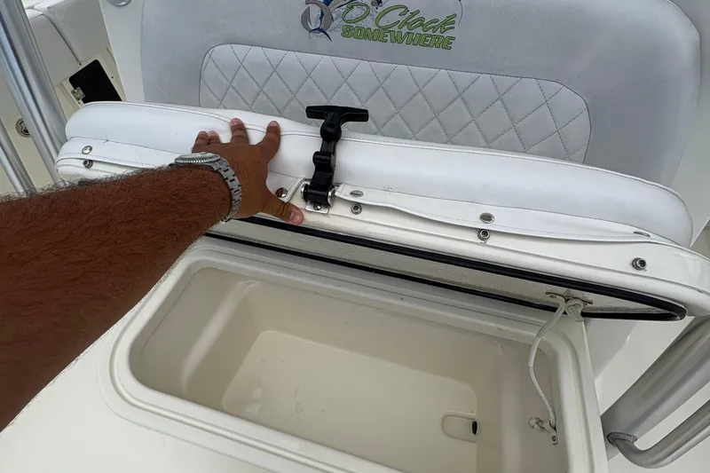 Slide: The Image of Hand opening storage compartment on 2007 Hydra-Sports Vector 3300 CC boat. - 16