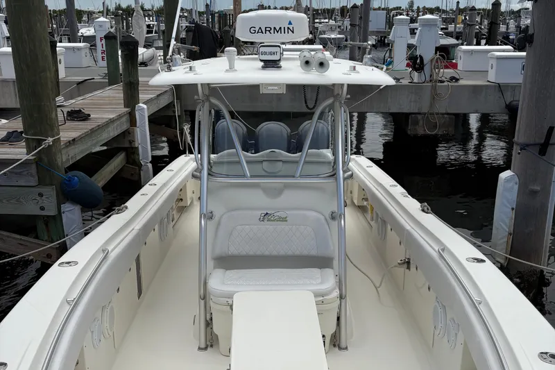 Slide: The Image of 2007 Hydra-Sports Vector 3300 CC boat docked at marina, featuring Garmin equipment. - 18
