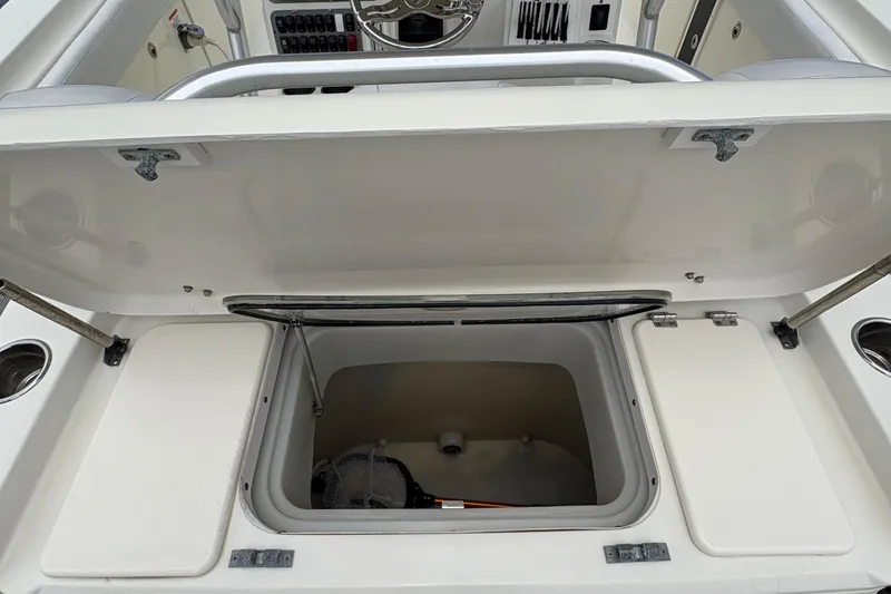 Slide: The Image of 2007 Hydra-Sports Vector 3300 CC boat storage compartment open, showcasing interior space. - 23