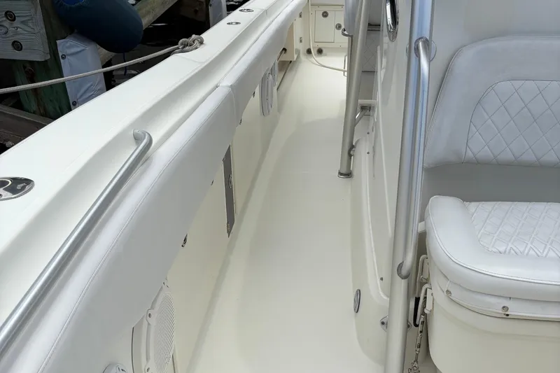 Slide: The Image of 2007 Hydra-Sports Vector 3300 CC boat interior with white seating and stainless steel railings. - 6