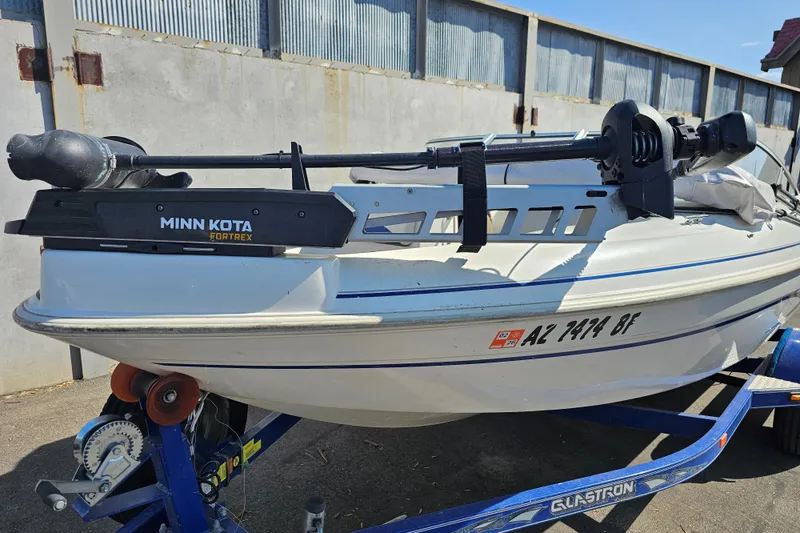 Slide: The Image of 2003 Glastron SFSX175 boat with Minn Kota Fortrex motor on trailer. - 5
