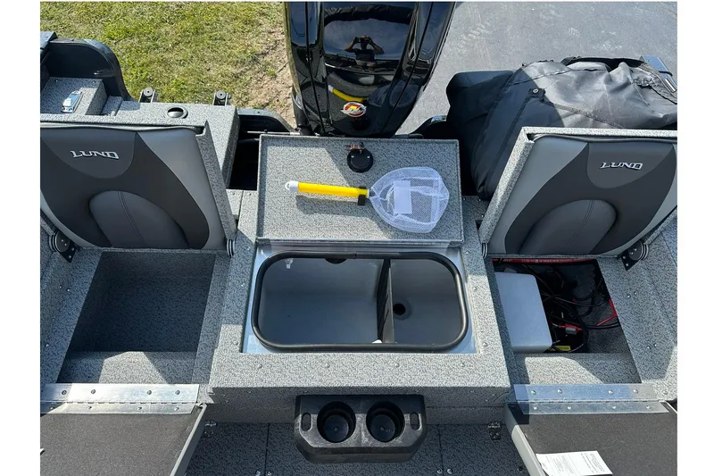 Slide: The Image of 2026 Lund 1775 Adventure Sport boat interior with seating and storage compartments. - 11