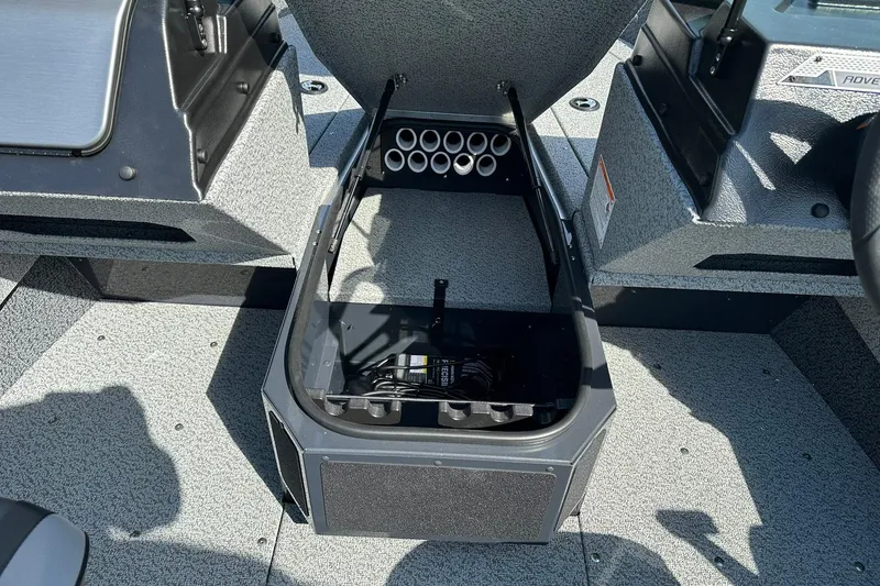 Slide: The Image of 2026 Lund 1775 Adventure Sport boat interior storage compartment with rod holders. - 12