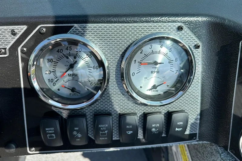 Slide: The Image of Dashboard of 2026 Lund 1775 Adventure Sport with speedometer and RPM gauges. - 16