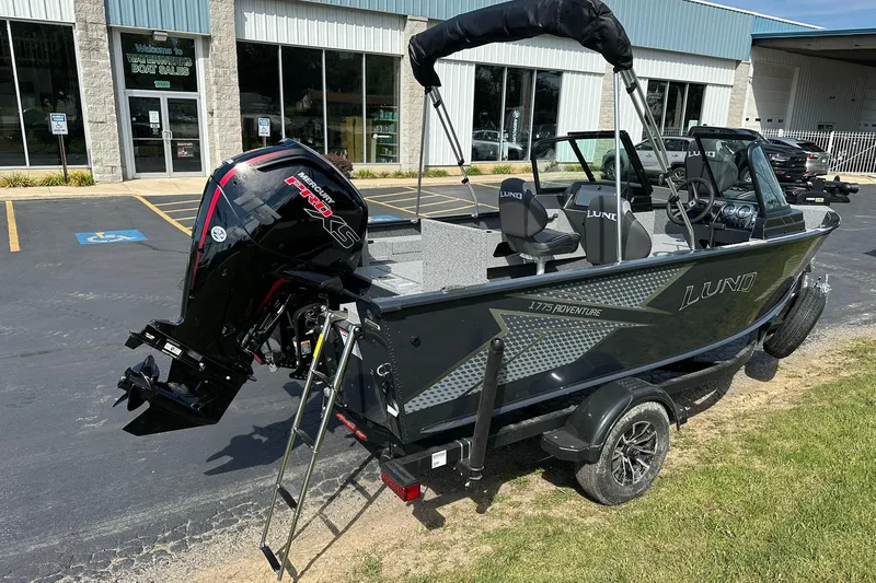 Slide: The Image of 2026 Lund 1775 Adventure Sport boat with Mercury engine at dealership. - 2