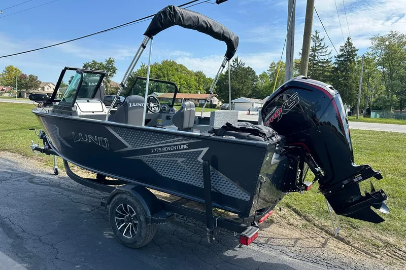 Slide: The Image of 2026 Lund 1775 Adventure Sport boat with powerful outboard motor on trailer. - 3
