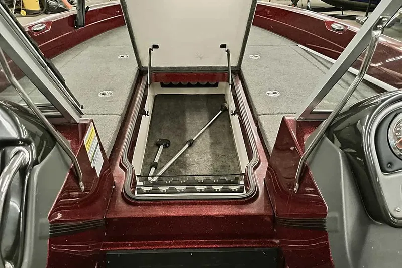 Slide: The Image of 2014 Ranger 621VS Fisherman boat with open storage compartment and fishing rod holder. - 13