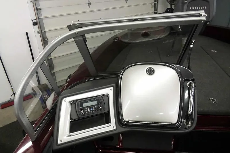 Slide: The Image of 2014 Ranger 621VS Fisherman boat dashboard with radio and storage compartment. - 28