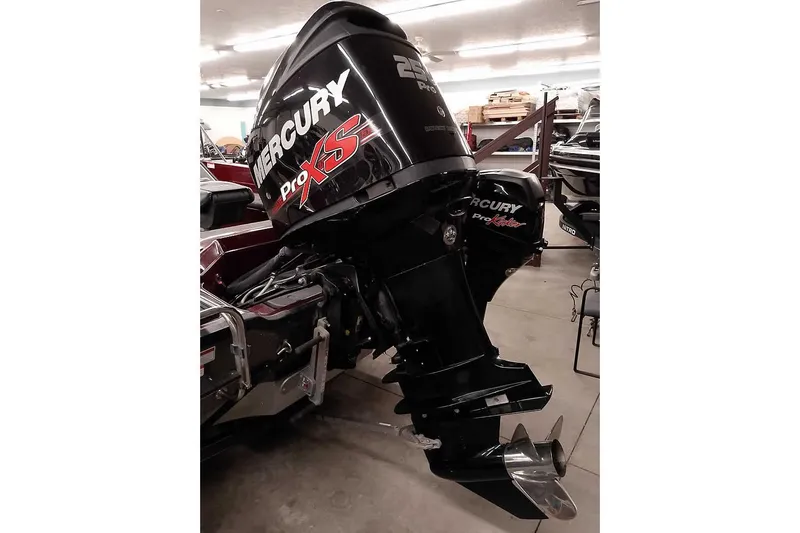 Slide: The Image of 2014 Ranger 621VS Fisherman with Mercury Pro XS outboard motor in a garage setting. - 3