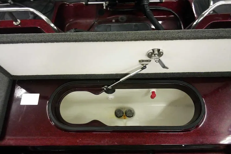 Slide: The Image of Livewell compartment in a 2014 Ranger 621VS Fisherman boat, featuring a secure latch system. - 31