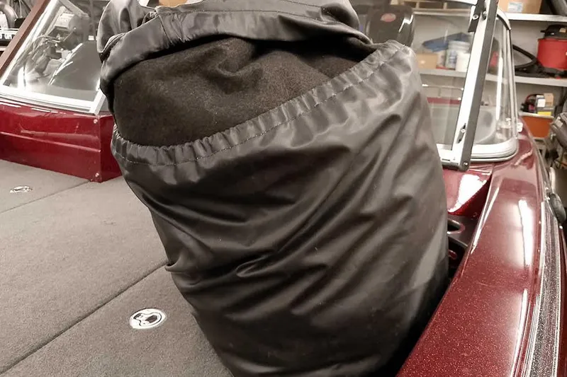 Slide: The Image of 2014 Ranger 621VS Fisherman boat interior with black cover and maroon accents. - 34