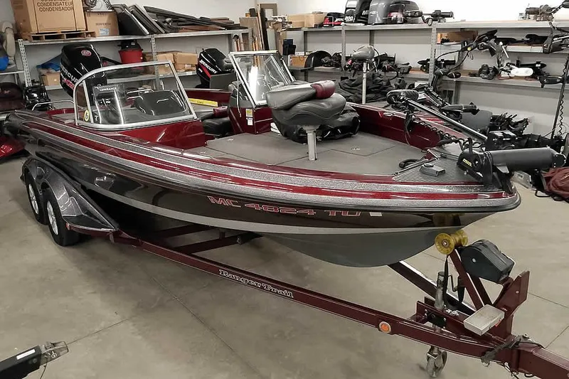Slide: The Image of 2014 Ranger 621VS Fisherman boat in a garage with equipment. - 35