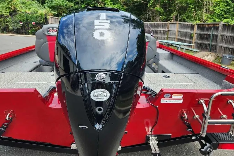 Slide: The Image of 2021 Ranger VS1782SC Angler boat with powerful 150 HP engine, red and gray interior. - 3