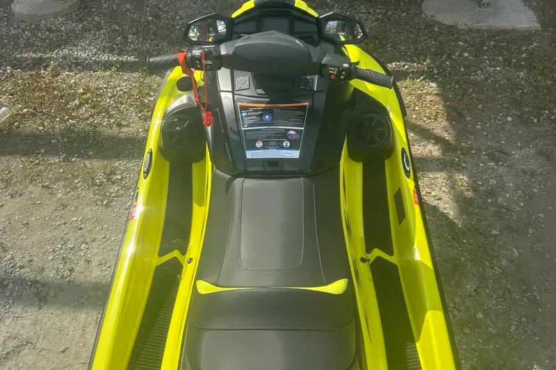 The Image of 2023 Yamaha WaveRunner VX Cruiser HO in bright yellow, top view on gravel. - 1