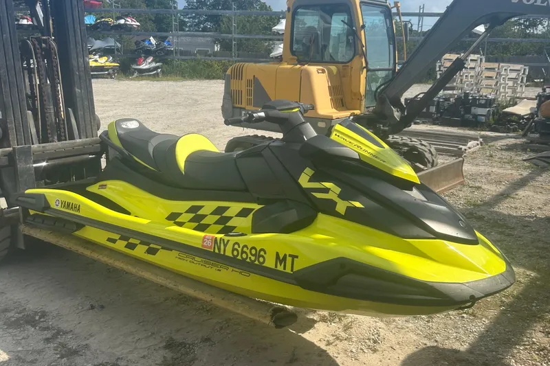 Slide: The Image of 2023 Yamaha WaveRunner VX Cruiser HO in vibrant yellow, parked outdoors. - 3