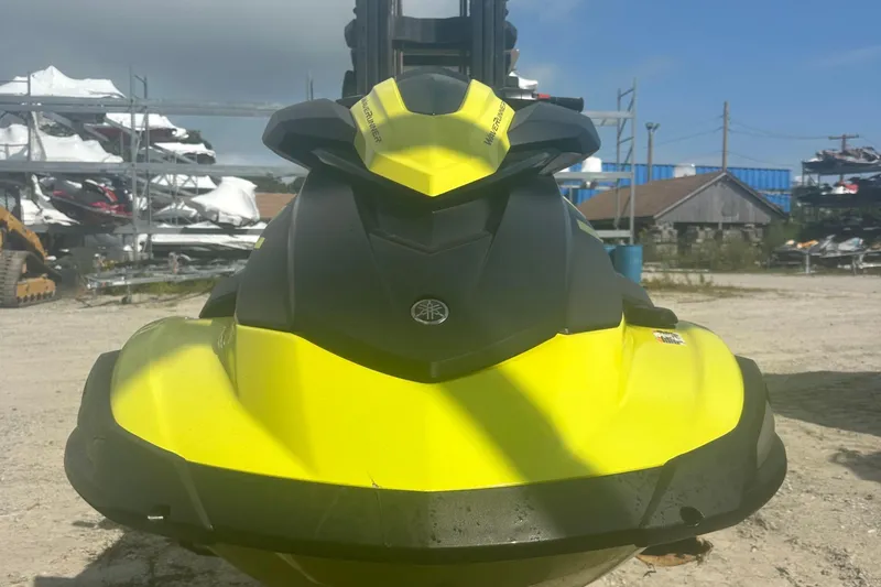 Slide: The Image of 2023 Yamaha WaveRunner VX Cruiser HO in vibrant yellow, parked outdoors. - 6