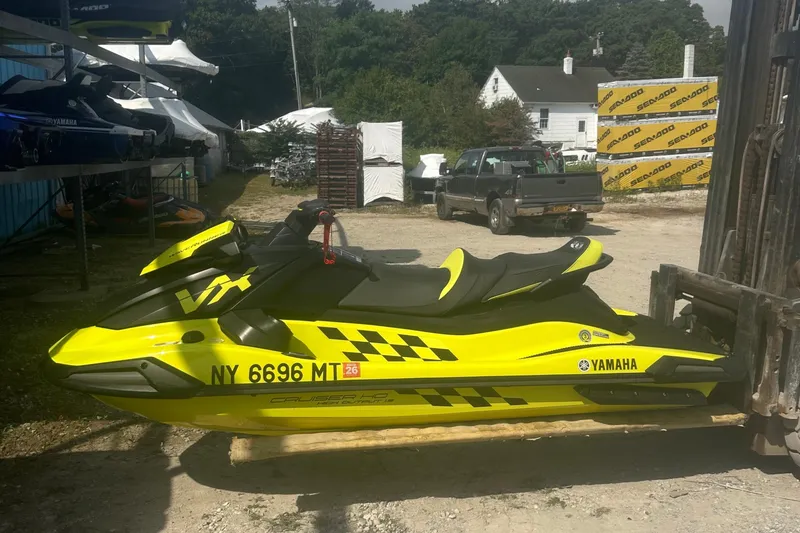 Slide: The Image of 2023 Yamaha WaveRunner VX Cruiser HO in bright yellow, parked outdoors. - 7