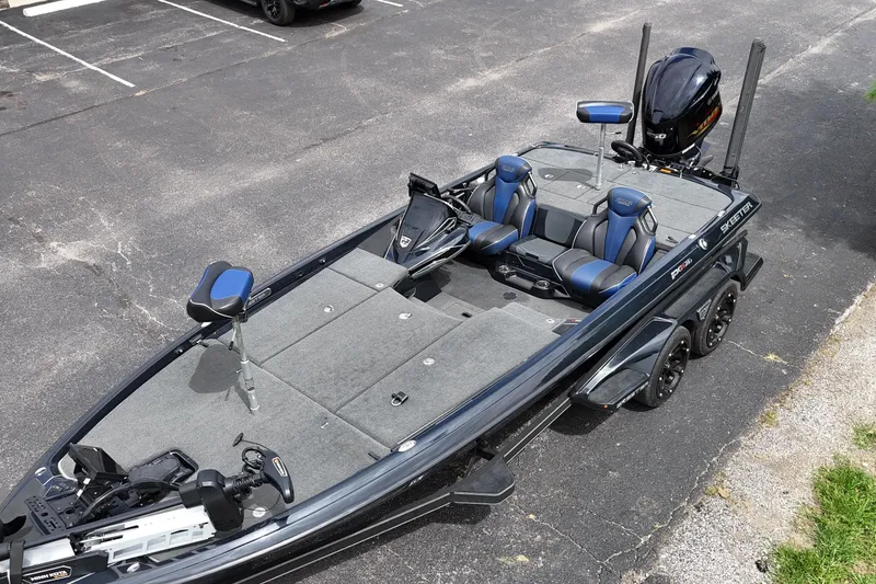 Slide: The Image of 2021 Skeeter FXR21 Apex bass boat with dual seats and trolling motor. - 14