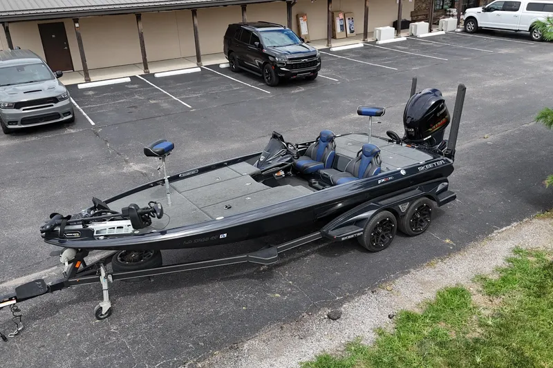 Slide: The Image of 2021 Skeeter FXR21 Apex fishing boat on trailer in parking lot. - 15