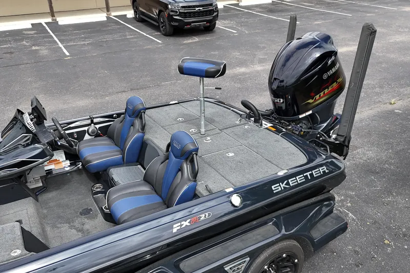 Slide: The Image of 2021 Skeeter FXR21 Apex boat with Yamaha VMAX engine in parking lot. - 22