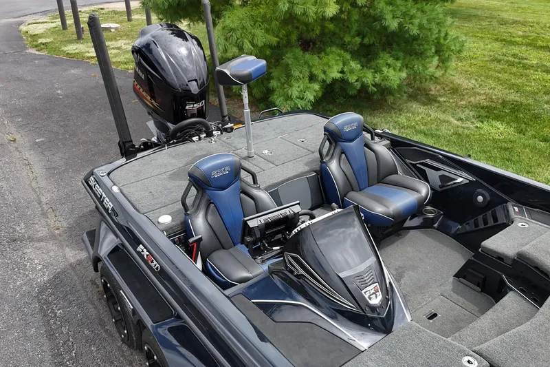 Slide: The Image of 2021 Skeeter FXR21 Apex boat with Yamaha engine, featuring blue and black seating. - 23