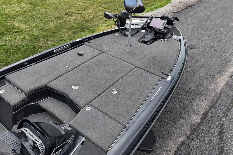 Slide: The Image of 2021 Skeeter FXR21 Apex fishing boat with carpeted deck and advanced navigation system. - 7