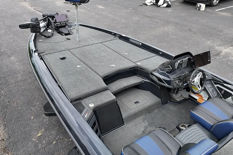 Slide: The Image of 2021 Skeeter FXR21 Apex boat interior with advanced controls and seating. - 9