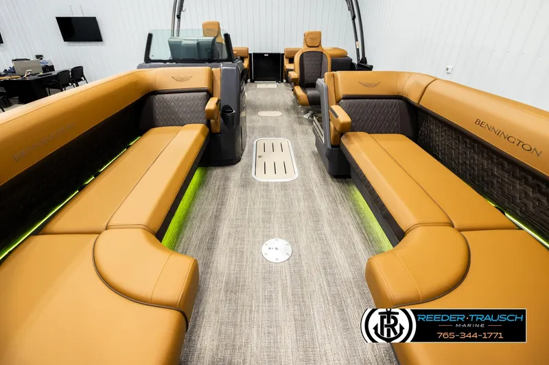 Slide: The Image of Luxurious interior of 2026 Bennington MFBSE pontoon boat with tan seating and modern design. - 13