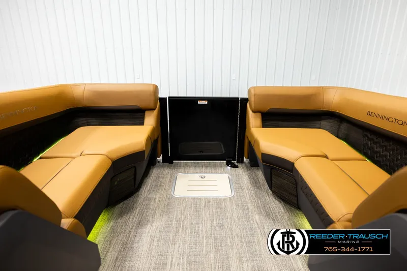Slide: The Image of 2026 Bennington MFBSE boat interior with tan seating and modern design. - 15