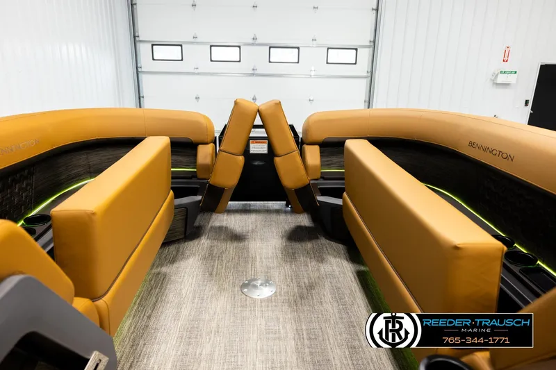 Slide: The Image of 2026 Bennington MFBSE boat interior with tan seating and modern design. - 21
