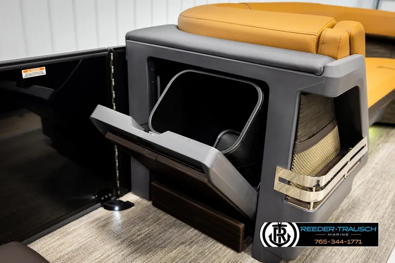 Slide: The Image of 2026 Bennington MFBSE boat interior with storage compartment and seating. - 23