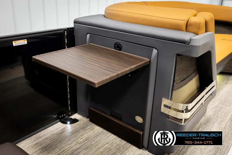 Slide: The Image of 2026 Bennington MFBSE boat interior with fold-out table and luxurious seating. - 24