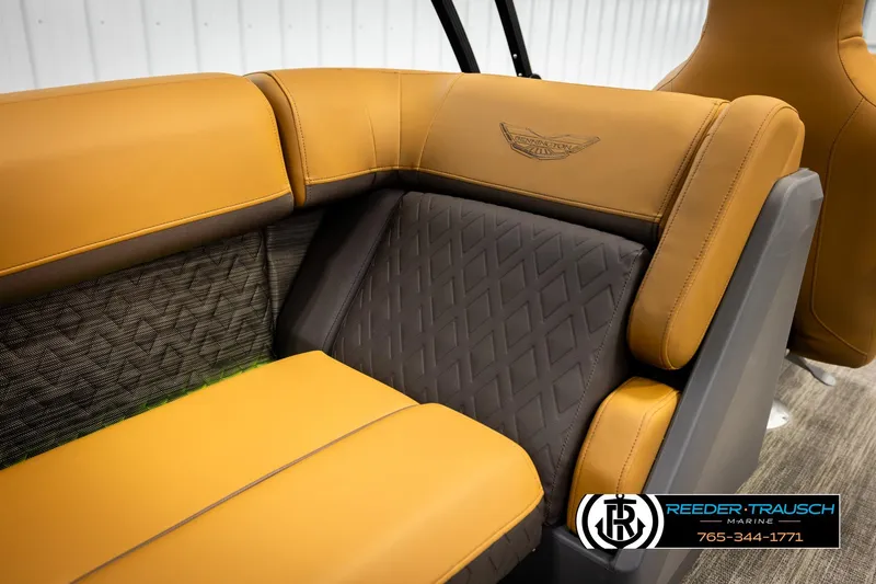 Slide: The Image of 2026 Bennington MFBSE boat interior with luxurious tan and gray seating. - 25