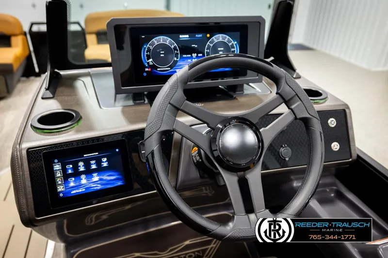 Slide: The Image of 2026 Bennington MFBSE boat dashboard with modern steering wheel and digital displays. - 28